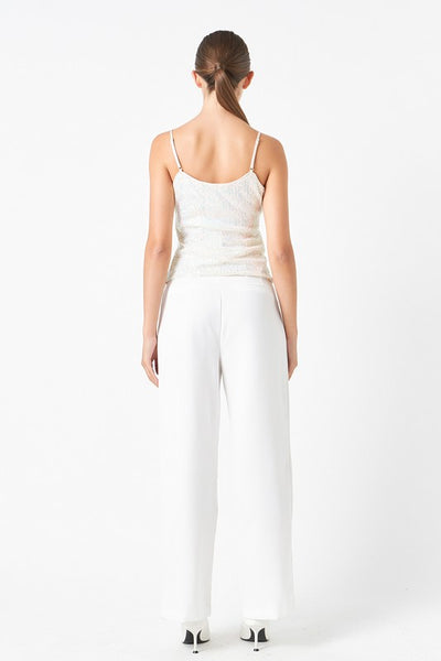 Top blanco de brillos con una flor (Nuevo)